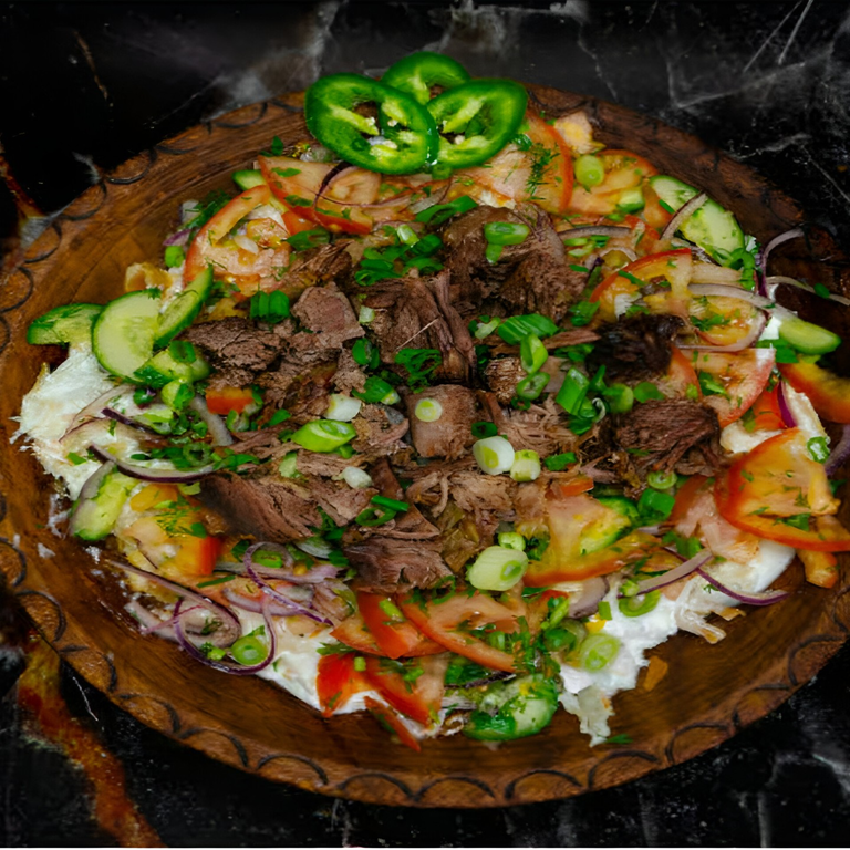 Qurutob with meat and vegetables from the restaurant website